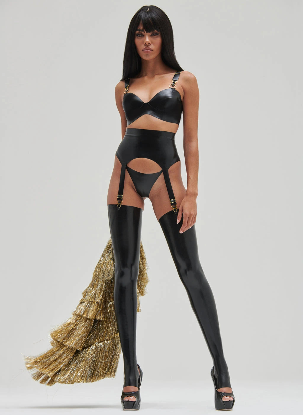 Sleek Black Latex Bra with Golden Accents and Adjustable Straps